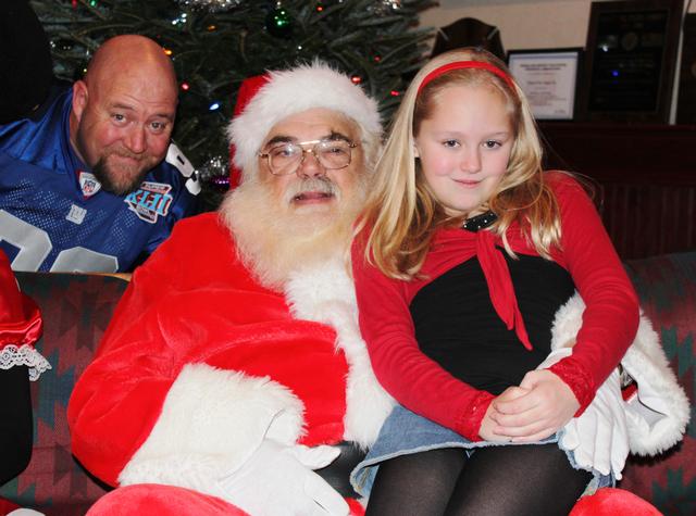 Children's Christmas Party at 8-100. 12-9-2012. Santa pays a visit . Photo by Vincent P. Tuzzolino